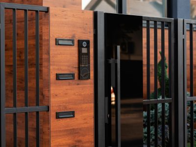 Intercom on entrance gate in front of a house.